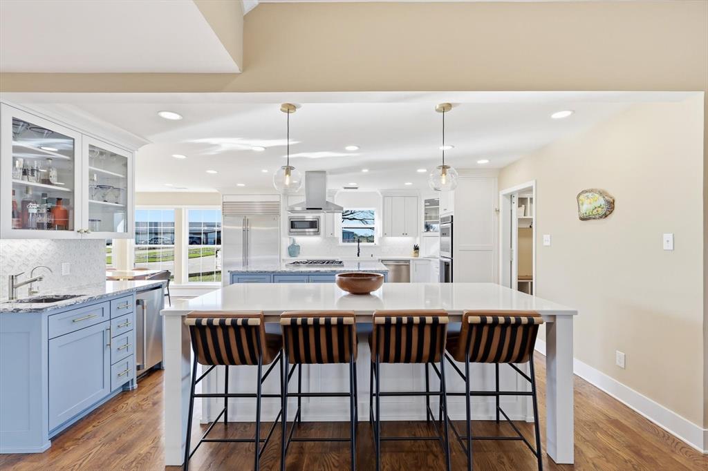 243 South King Road Heath, TX 75126 - Photo 15 of 40 a kitchen with a table and chairs in it