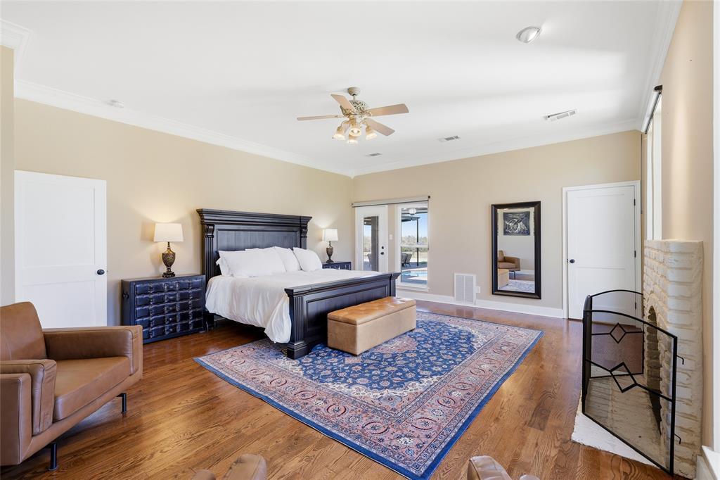 243 South King Road Heath, TX 75126 - Photo 22 of 40 a bedroom with furniture and a rug