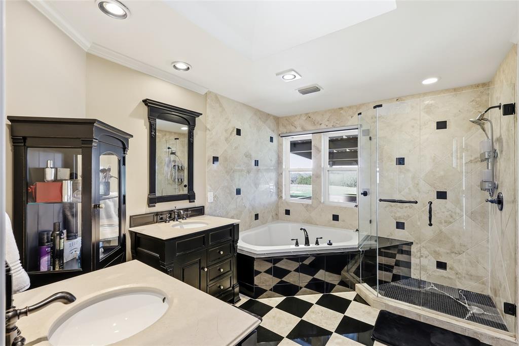 243 South King Road Heath, TX 75126 - Photo 25 of 40 a bathroom with a sink toilet a shower and a mirror