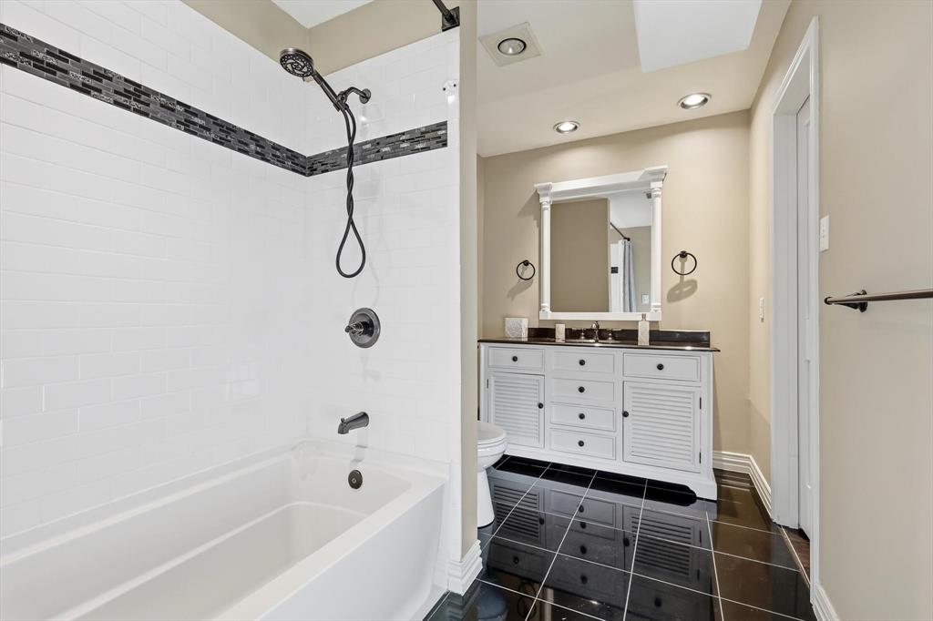 243 South King Road Heath, TX 75126 - Photo 28 of 40 a bathroom with a bathtub vanity and a shower