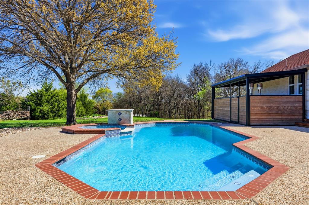 243 South King Road Heath, TX 75126 - Photo 33 of 40 a view of swimming pool with trees in the background