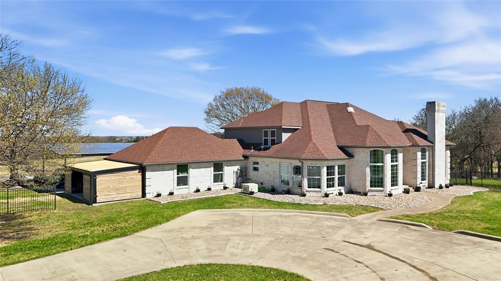 243 South King Road Heath, TX 75126 - Photo 4 of 40 a front view of a house with yard patio and fire pit