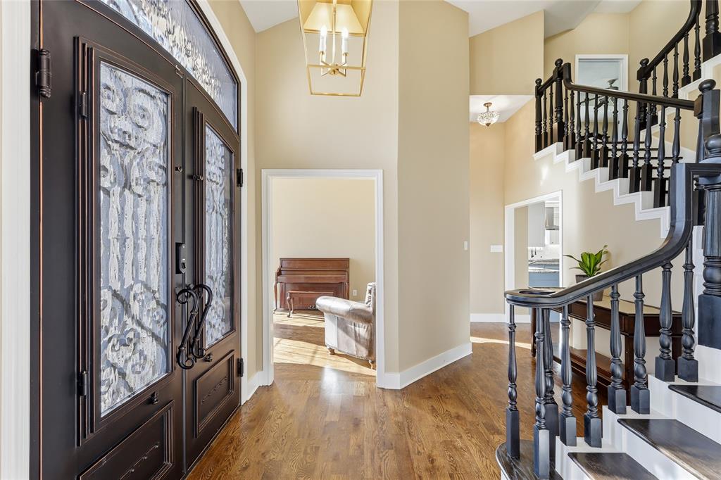 243 South King Road Heath, TX 75126 - Photo 6 of 40 a view of a hallway with wooden floor and stairs