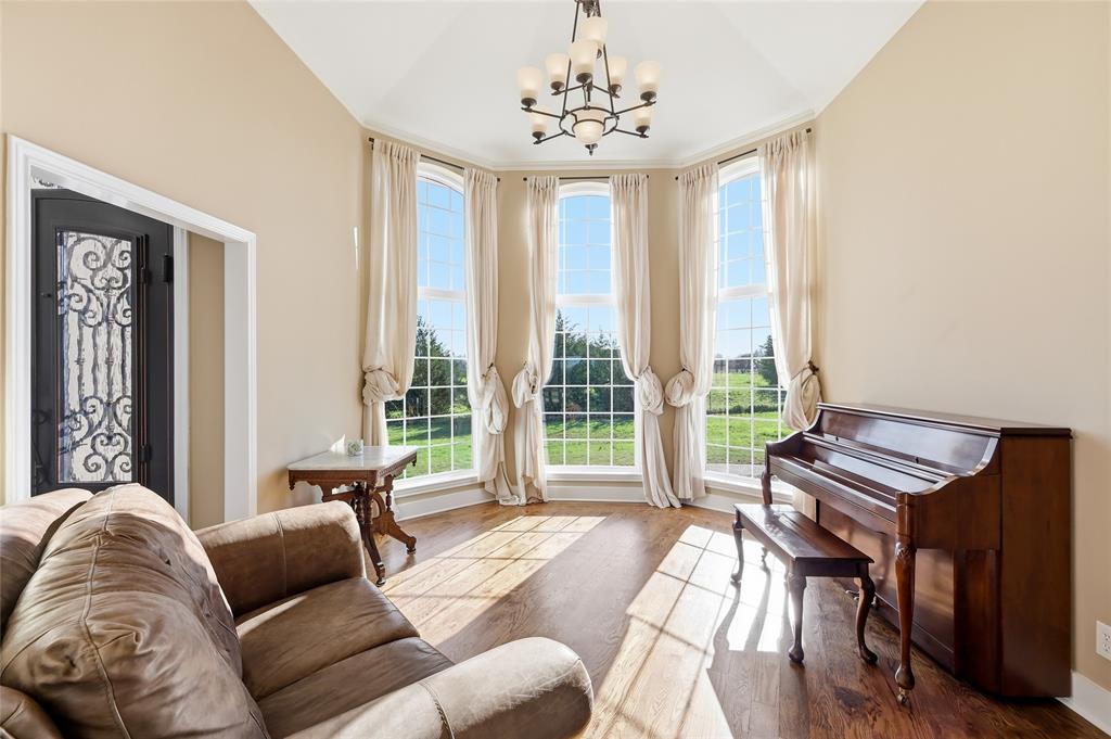 243 South King Road Heath, TX 75126 - Photo 8 of 40 a living room with furniture and a large window