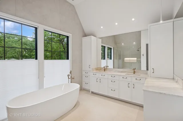 a bathroom with a bathtub and a sink