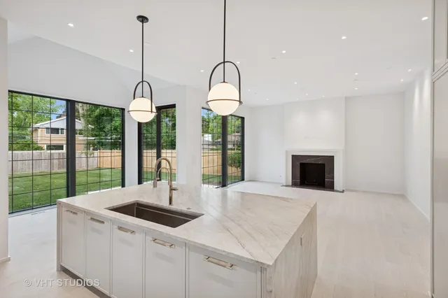 a kitchen with sink and window