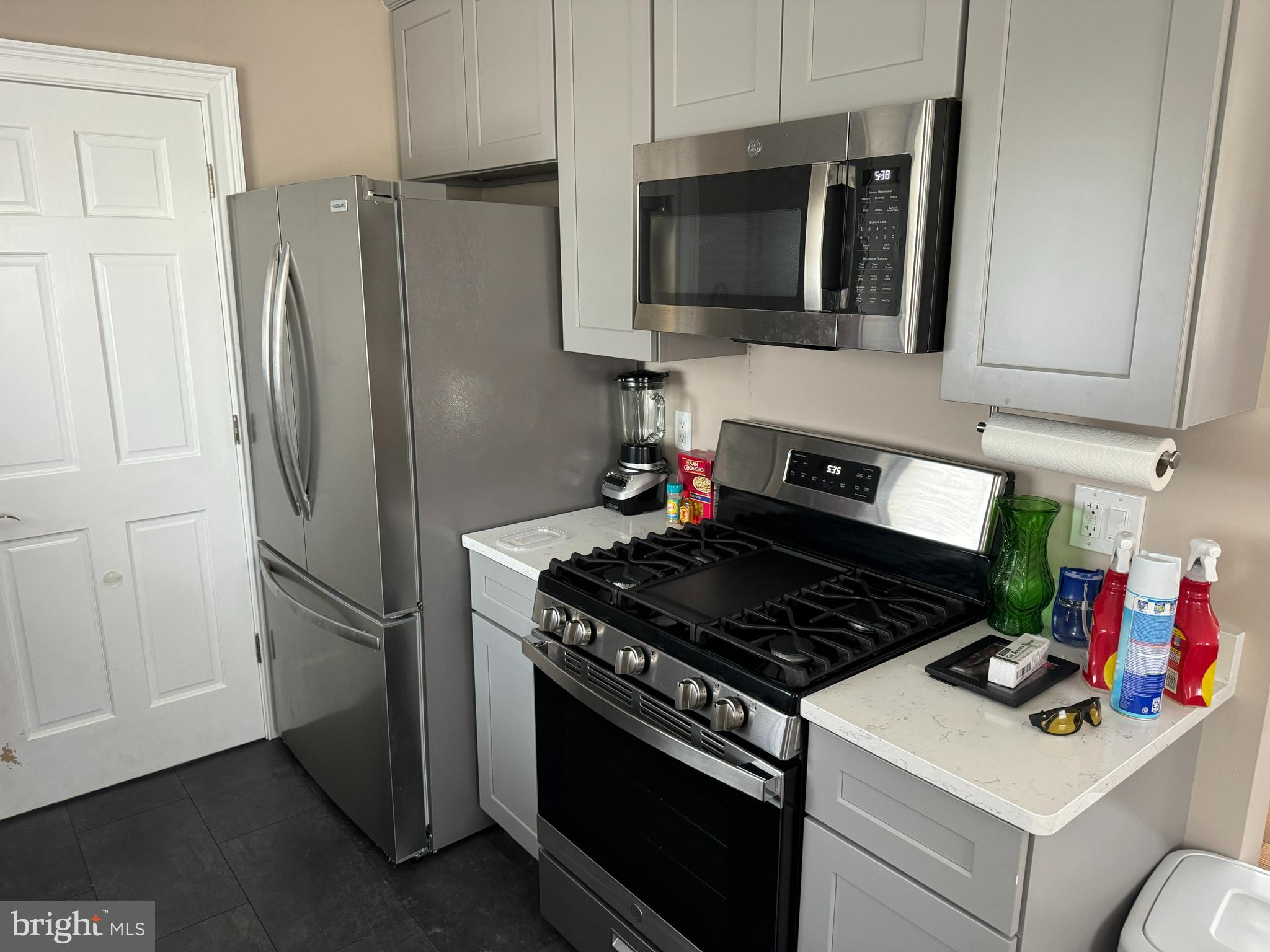 2006 A Avenue Atco, NJ 08004 - Photo 3 of 14 a kitchen with stainless steel appliances granite countertop a stove refrigerator and microwave