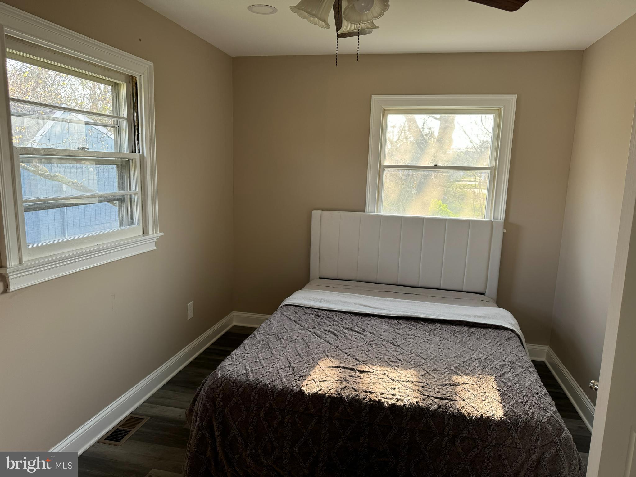 2006 A Avenue Atco, NJ 08004 - Photo 6 of 14 a bed sitting in a bedroom next to a window