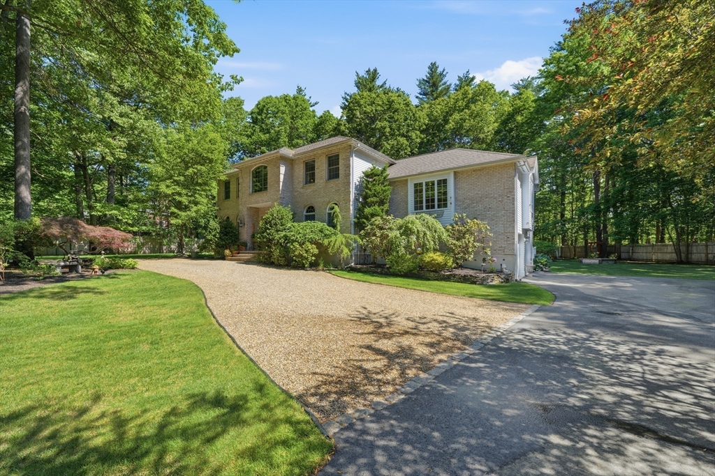 25 Haymeadow Road Boxford, MA 01921 - Photo 4 of 42 a front view of a house with garden