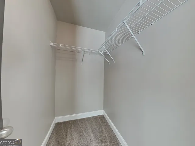 a view of a room with rack on the wall