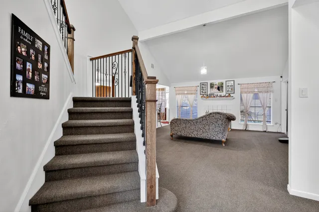 a bedroom with furniture and a book shelf