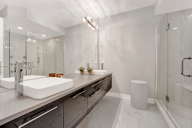 a bathroom with a double vanity sink and a mirror