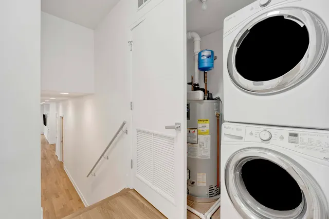 a view of a hallway with washer and dryer