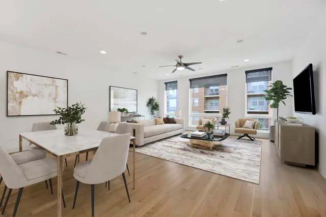a living room with fireplace furniture and a flat screen tv