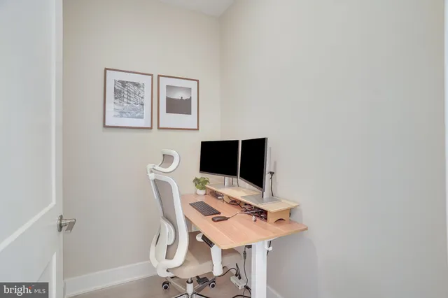 a view of a bathroom from a hallway