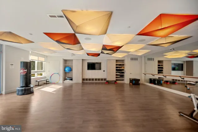 a view of a gym equipment and a living room