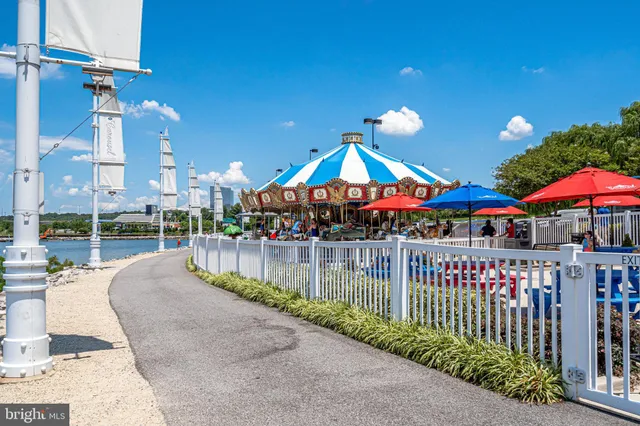 a view of a patio with a table and chairs under an umbrella