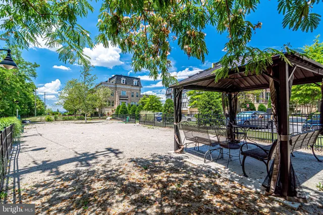 a view of an apartment with a swimming pool
