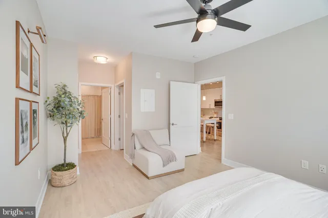 a bedroom with a large bed and a window