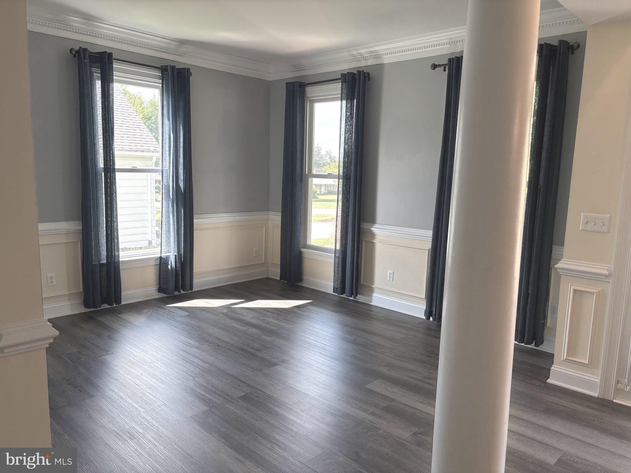629 Country Club Road Culpeper, VA 22701 - Photo 6 of 27 an empty room with wooden floor and windows