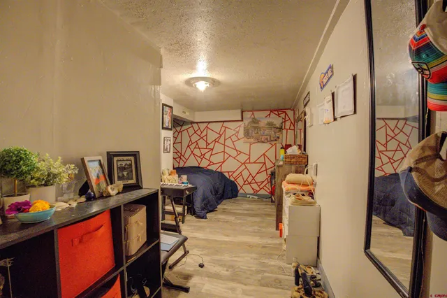 a bedroom with furniture and a window