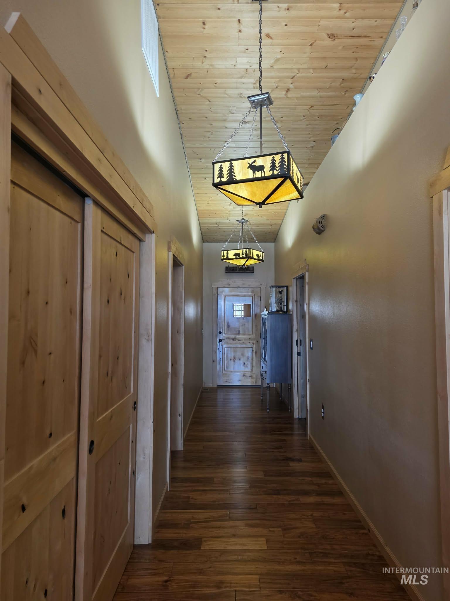 809 River Pointe Lane Lenore, ID 83541 - Photo 25 of 43 Corridor with a vaulted wooden ceiling and dark wood-style flooring