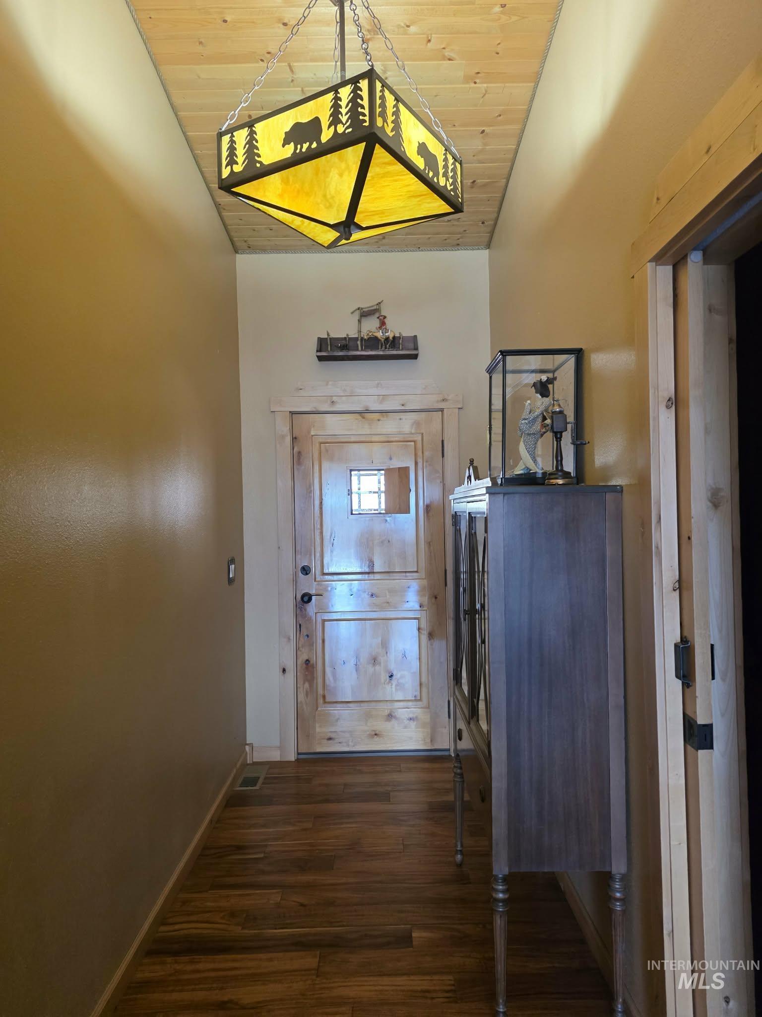 809 River Pointe Lane Lenore, ID 83541 - Photo 27 of 43 Hall with wood ceiling and dark wood-style flooring