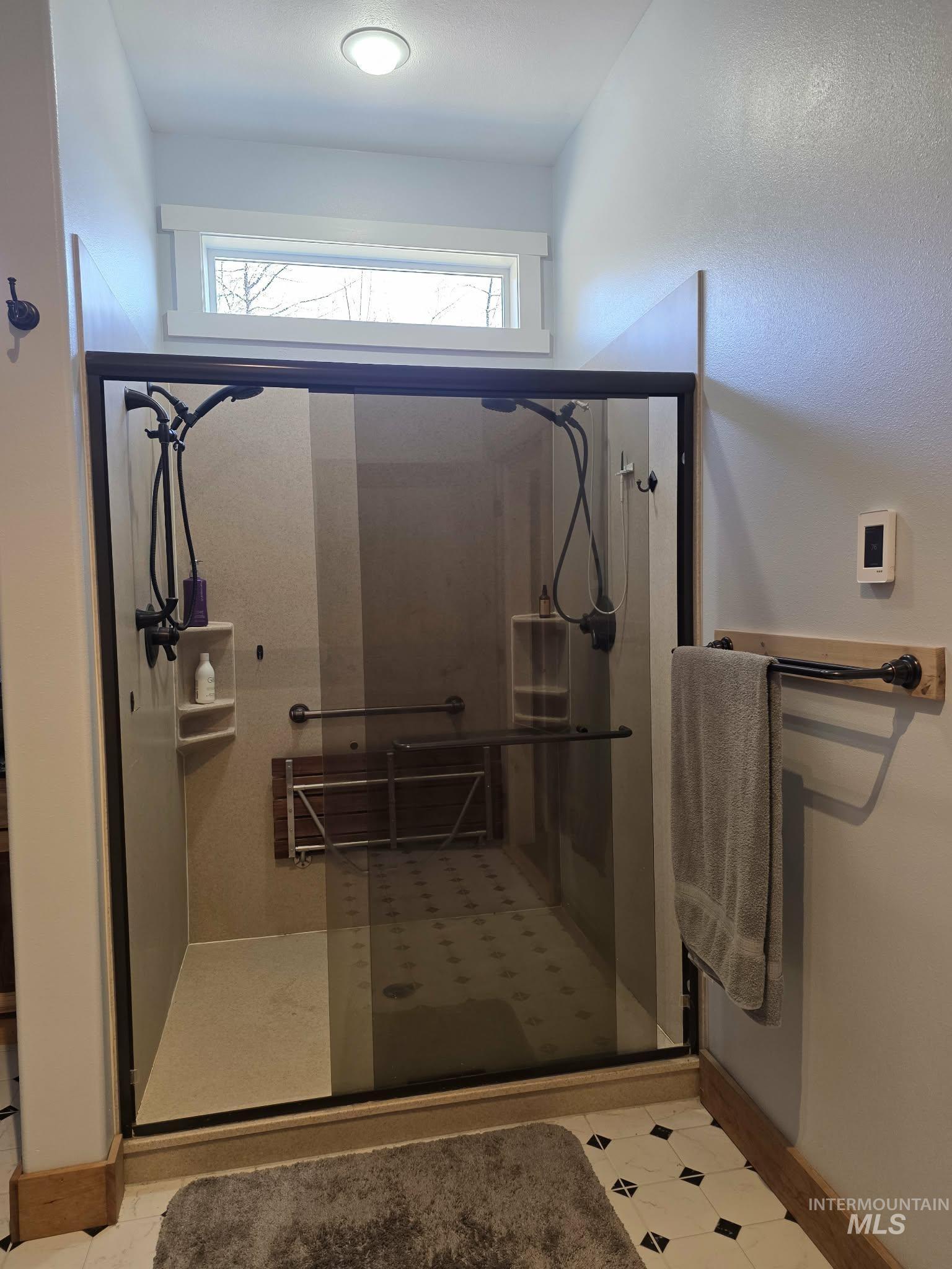 809 River Pointe Lane Lenore, ID 83541 - Photo 34 of 43 Full bathroom with a shower stall and baseboards