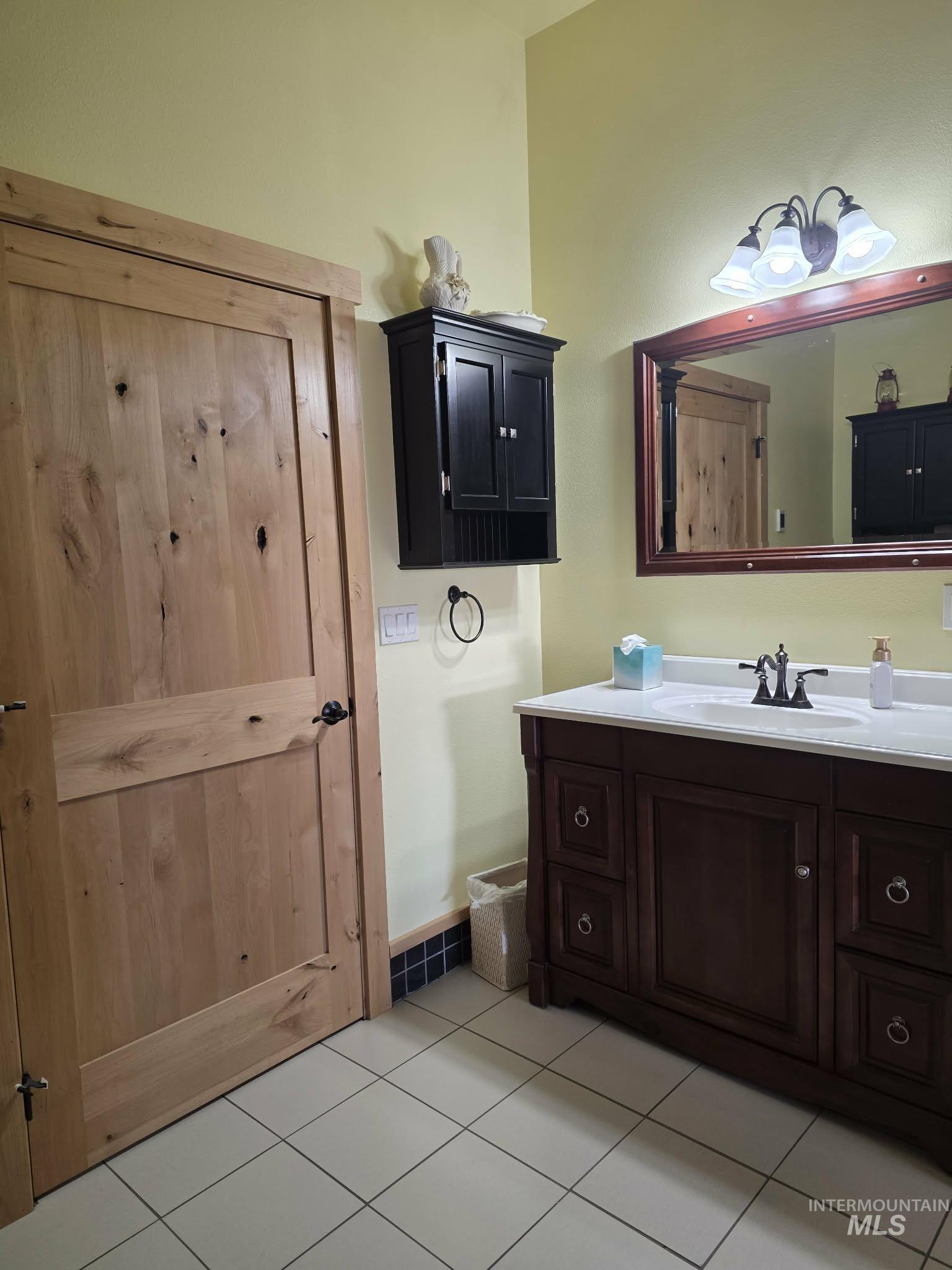 809 River Pointe Lane Lenore, ID 83541 - Photo 37 of 43 Bathroom with vanity and light tile patterned flooring