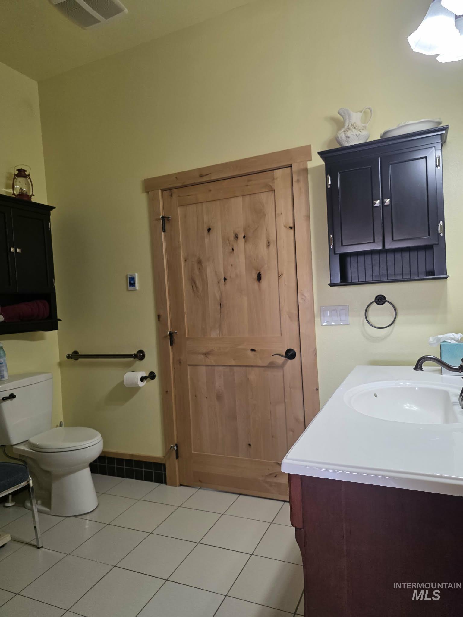 809 River Pointe Lane Lenore, ID 83541 - Photo 39 of 43 Bathroom featuring vanity and light tile patterned floors