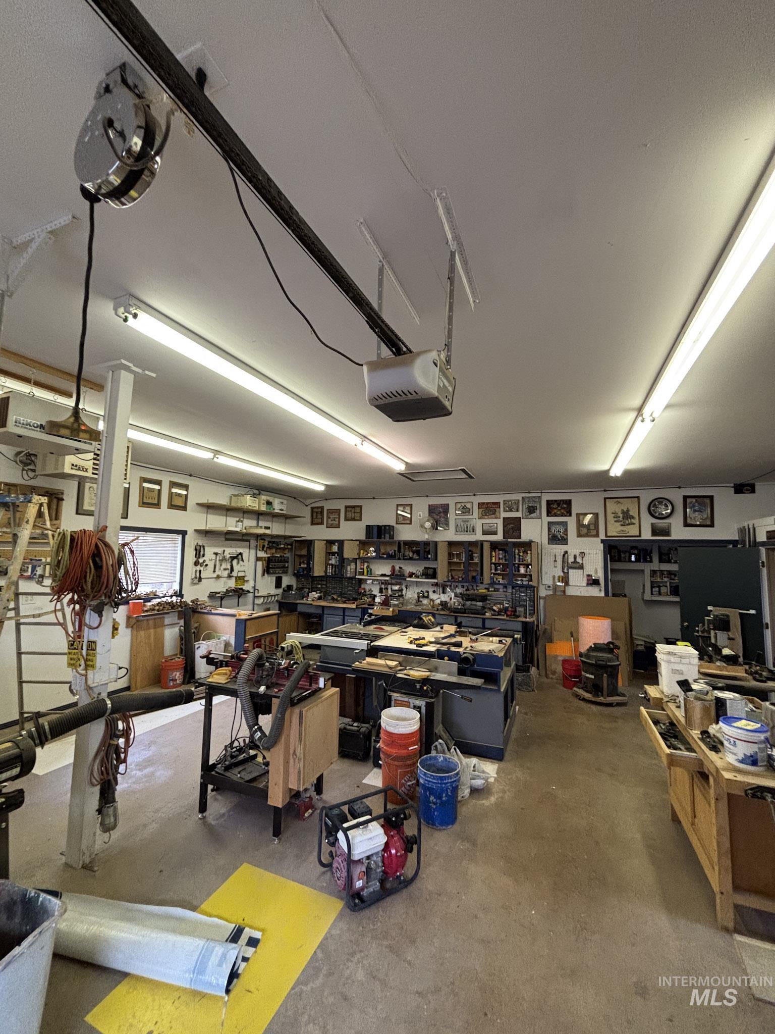 809 River Pointe Lane Lenore, ID 83541 - Photo 4 of 43 Garage featuring a workshop area and a garage door opener