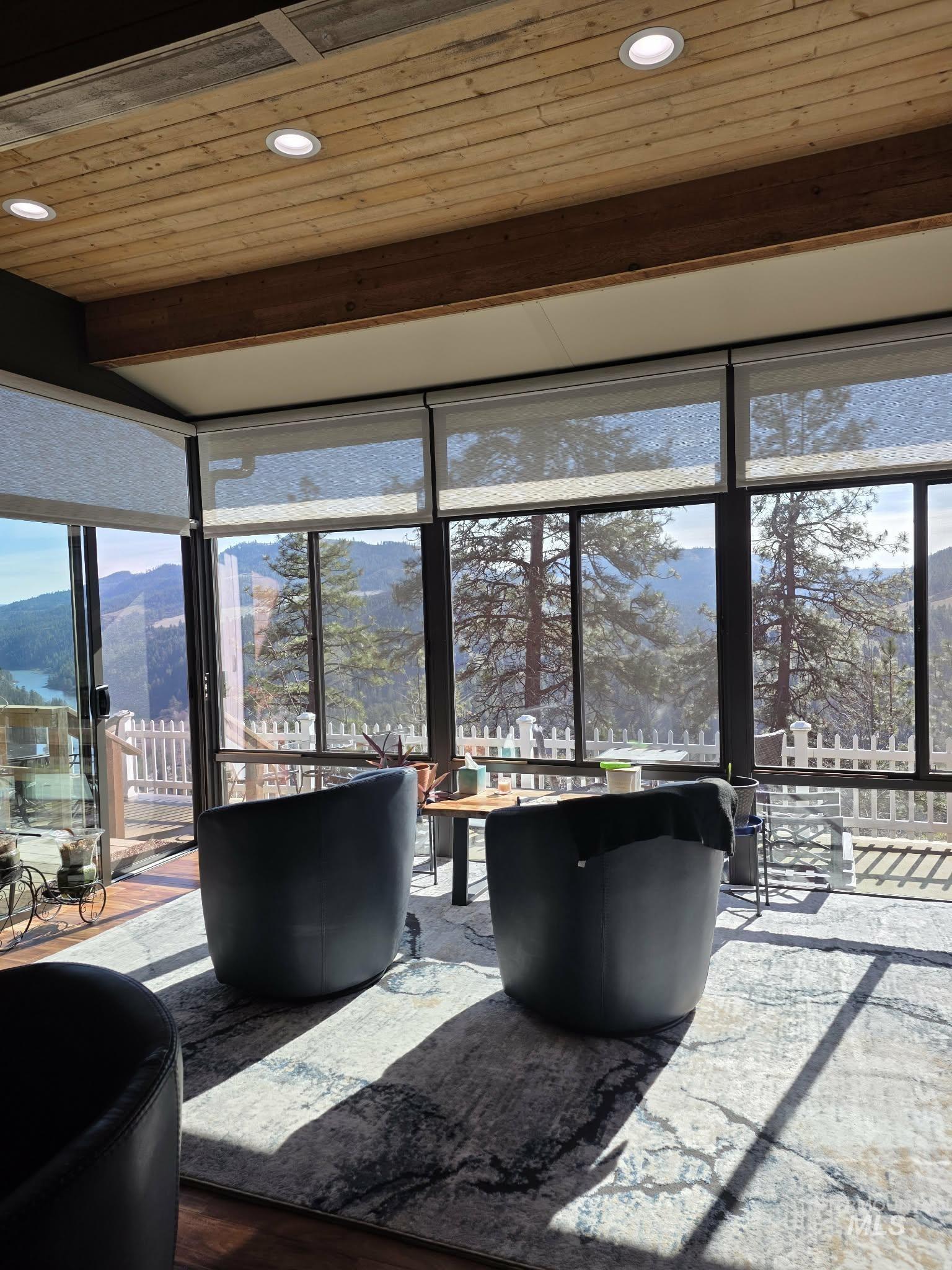 809 River Pointe Lane Lenore, ID 83541 - Photo 6 of 43 Sunroom / solarium featuring a mountain view and beamed ceiling