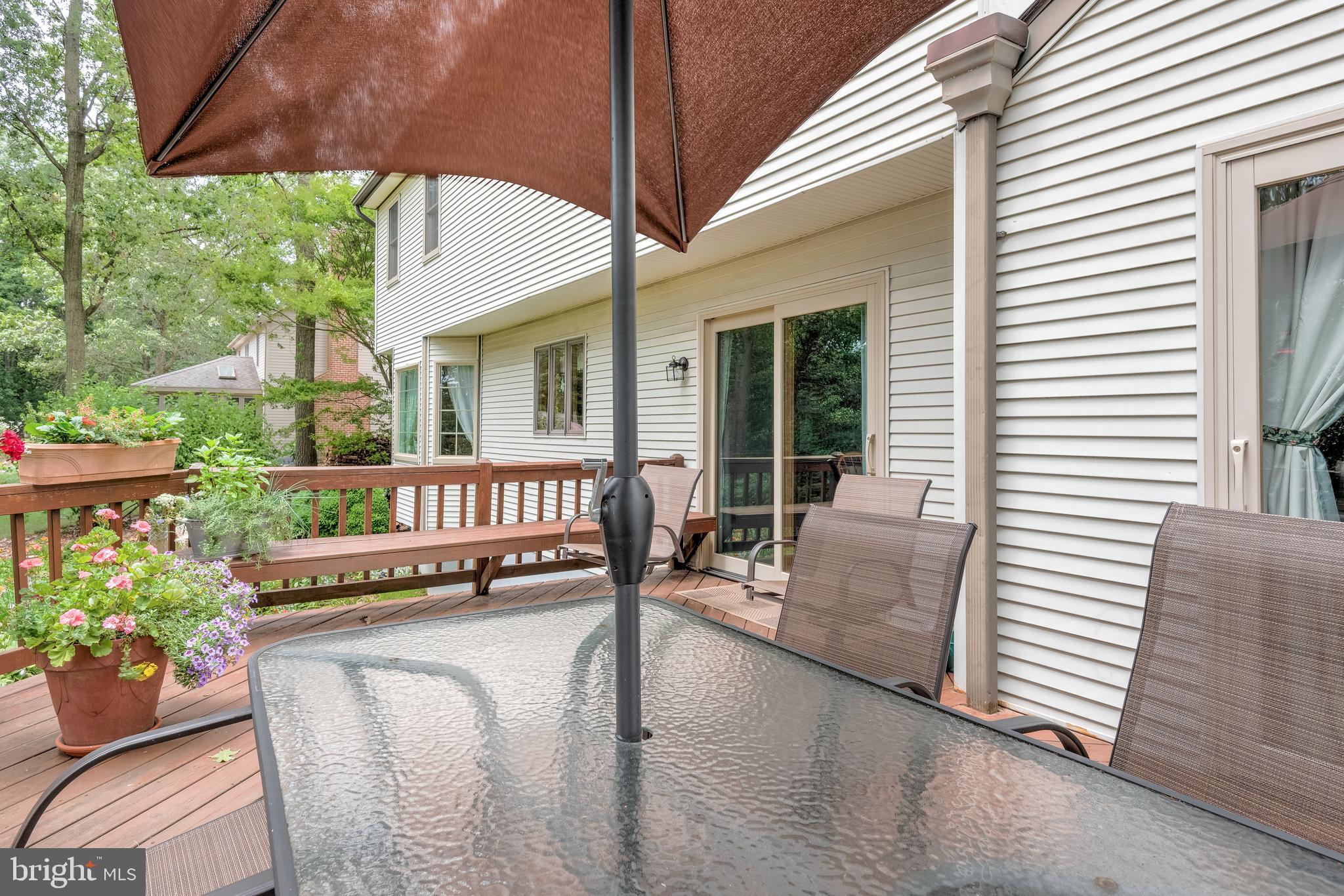 5362 Field Pointe Drive Spring Grove, PA 17362 - Photo 17 of 43 a view of a patio with couches table and chairs under an umbrella