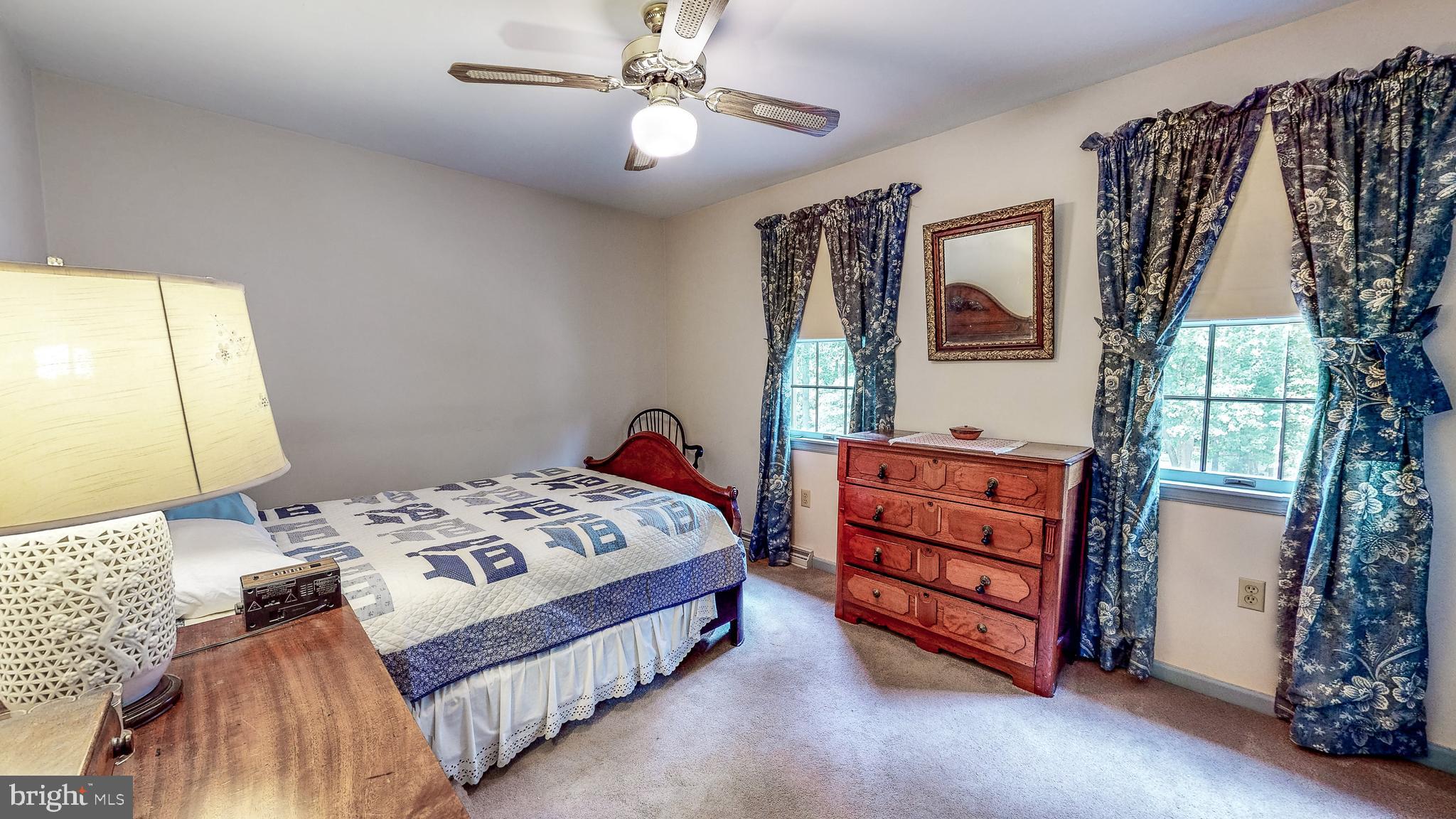 5362 Field Pointe Drive Spring Grove, PA 17362 - Photo 23 of 43 a bedroom with a bed and a chandelier