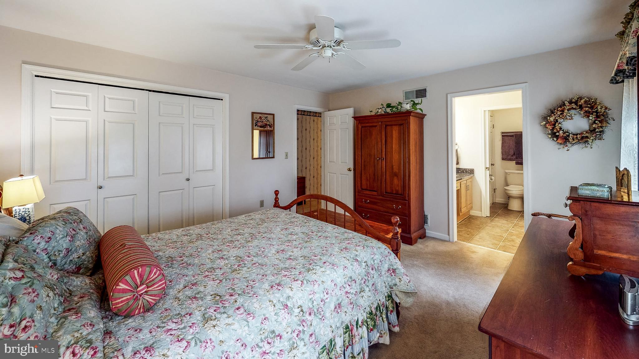 5362 Field Pointe Drive Spring Grove, PA 17362 - Photo 26 of 43 a bedroom with a large bed and a chandelier