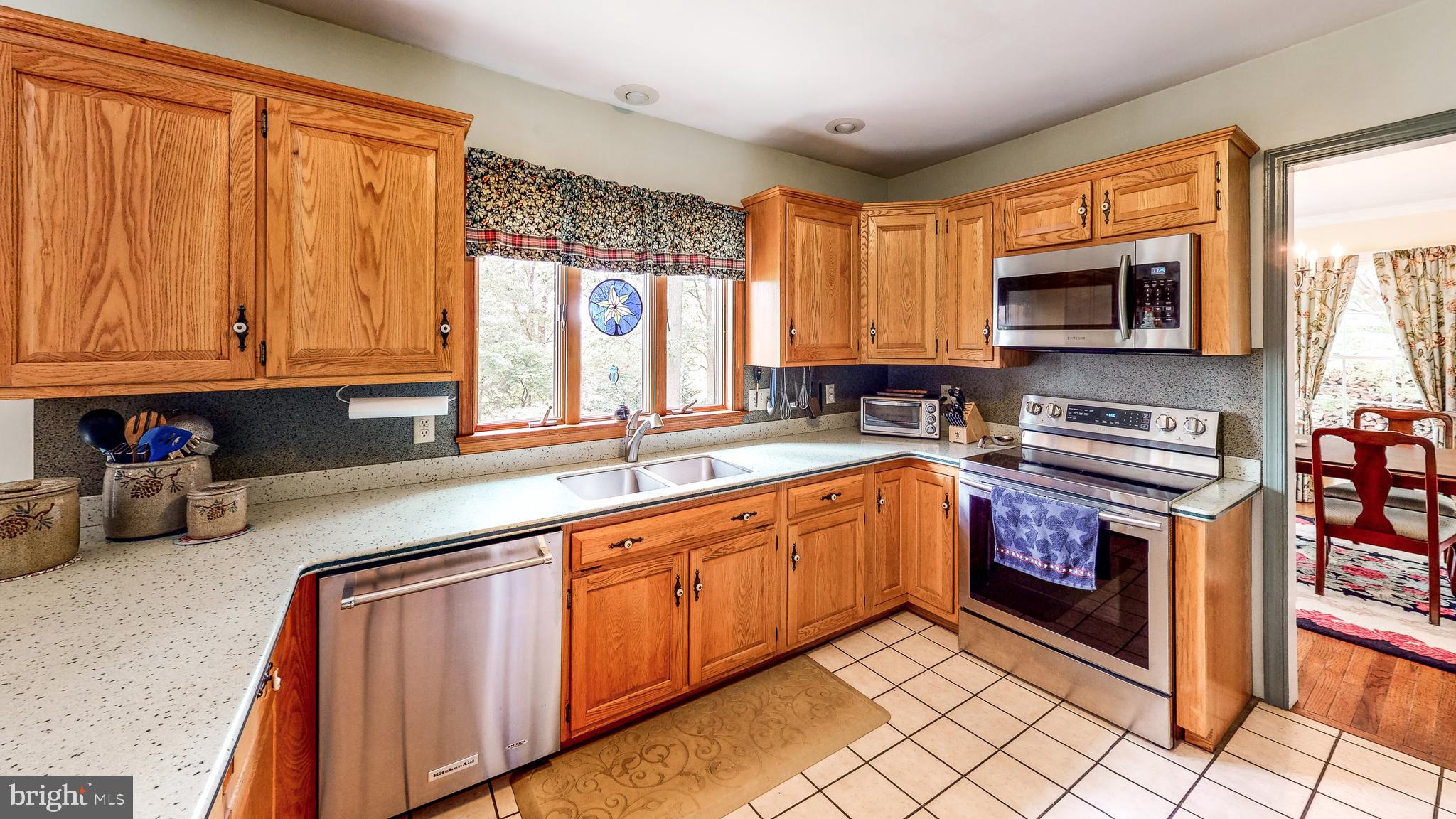 5362 Field Pointe Drive Spring Grove, PA 17362 - Photo 38 of 43 a kitchen with stainless steel appliances granite countertop a stove sink and cabinets