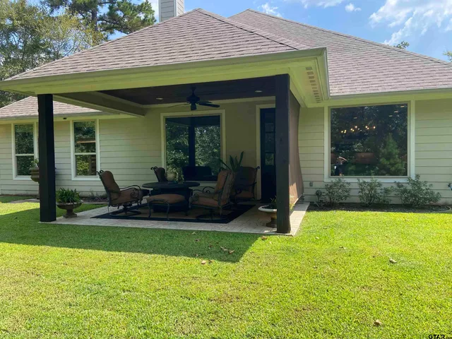a view of a house with backyard porch and porch
