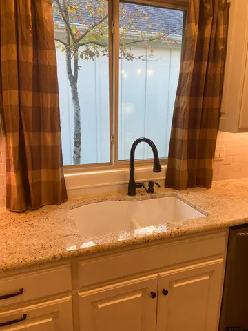 a bathroom with a sink and mirror