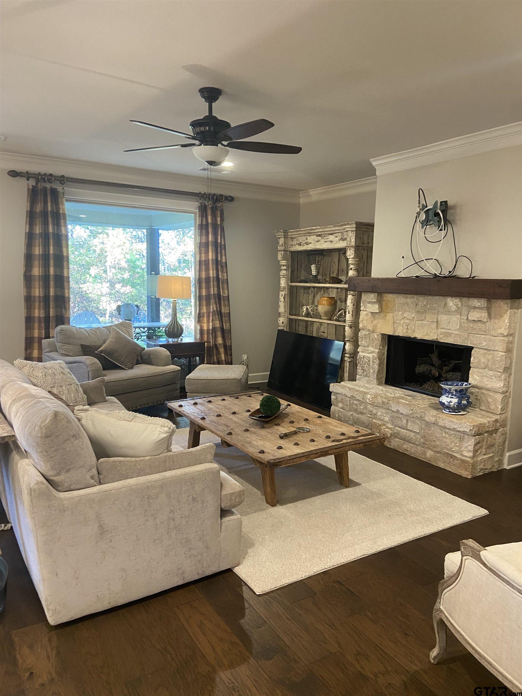 16864 Easy Street Flint, TX 75762 - Photo 19 of 34 a living room with furniture and a fireplace