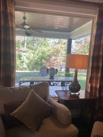 a living room with furniture and a window