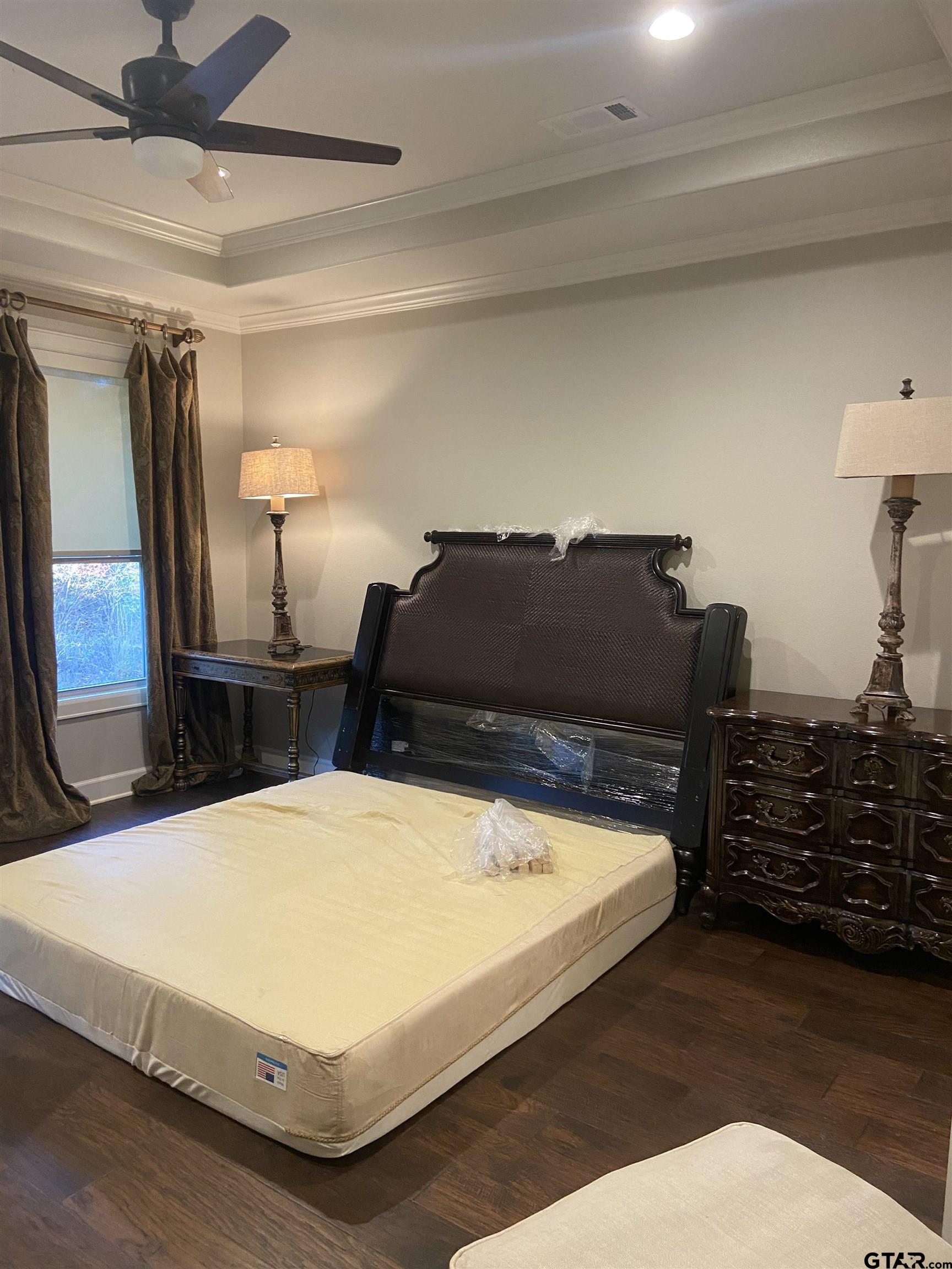 16864 Easy Street Flint, TX 75762 - Photo 22 of 34 a bed sitting in a bedroom next to a window