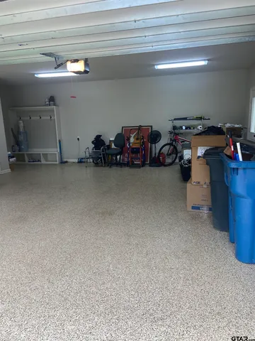 a view of a garage with parked cars