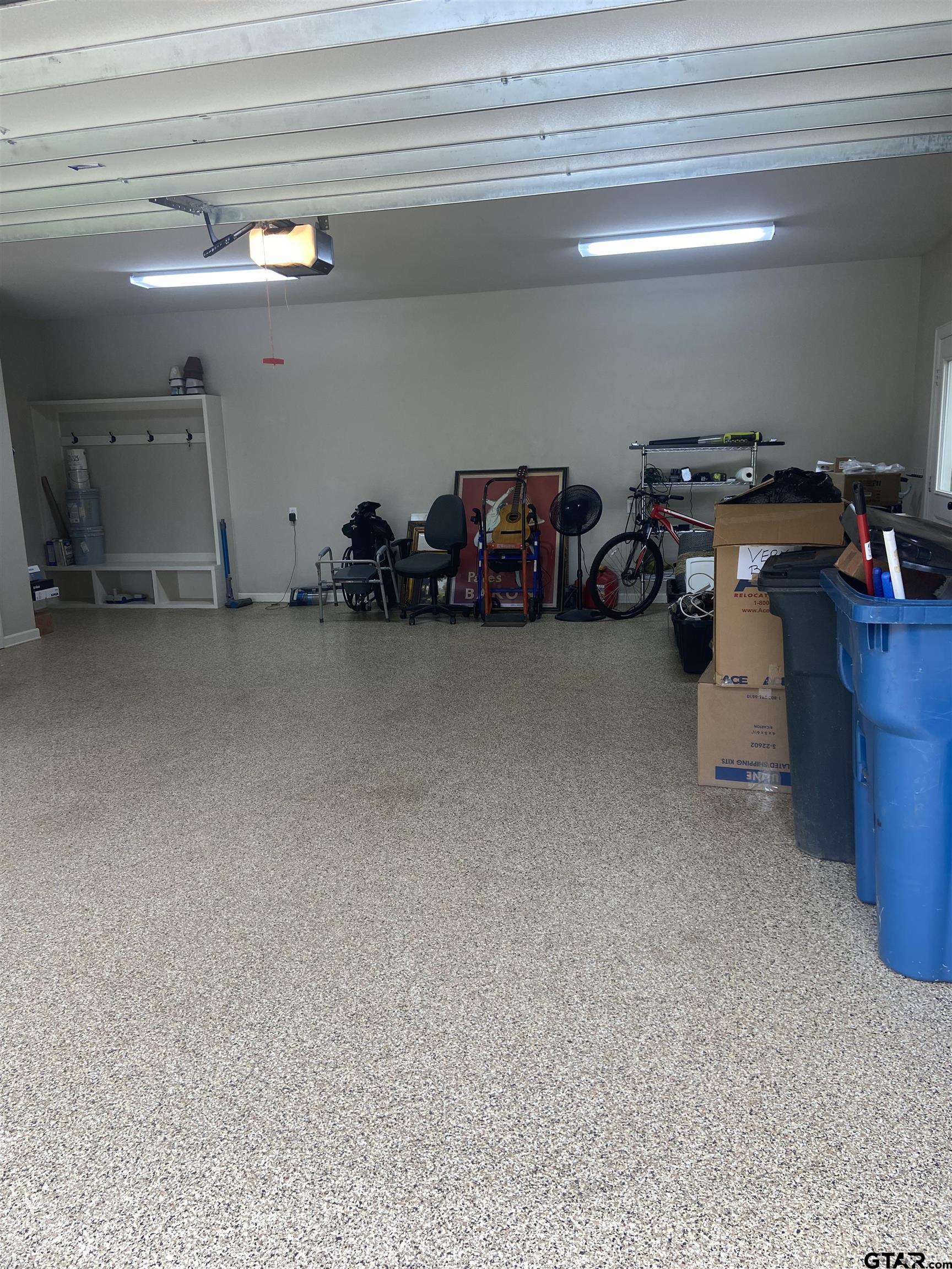 16864 Easy Street Flint, TX 75762 - Photo 33 of 34 a view of a garage with parked cars