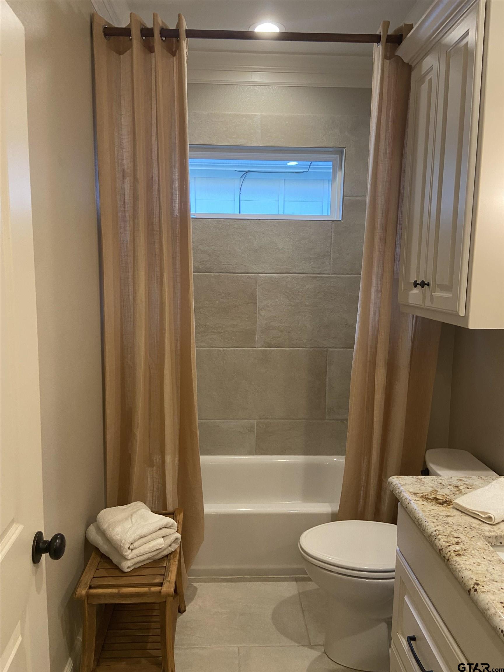16864 Easy Street Flint, TX 75762 - Photo 8 of 34 a bathroom with a sink a toilet and shower