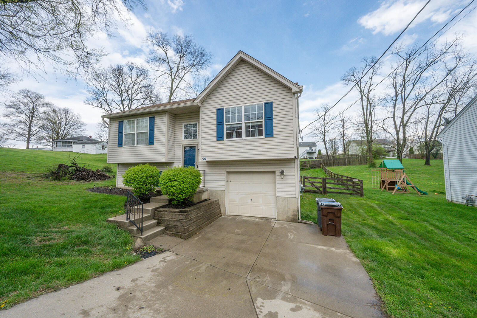 29 School Road Walton, KY 41094 - Photo 1 of 30 Split-level residence featuring light-colored siding and blue window shutters