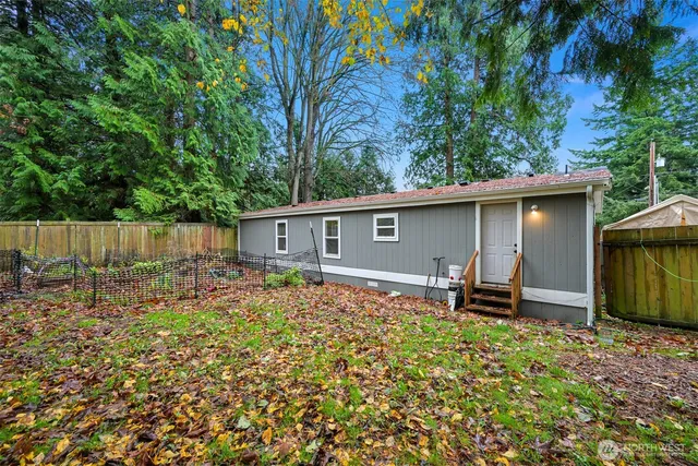 a backyard of a house with seating space