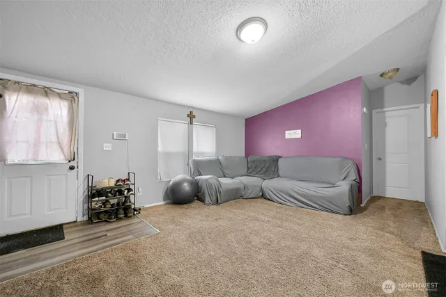 a livingroom with furniture and a window