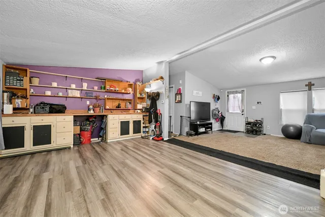 a bedroom with furniture and a fireplace