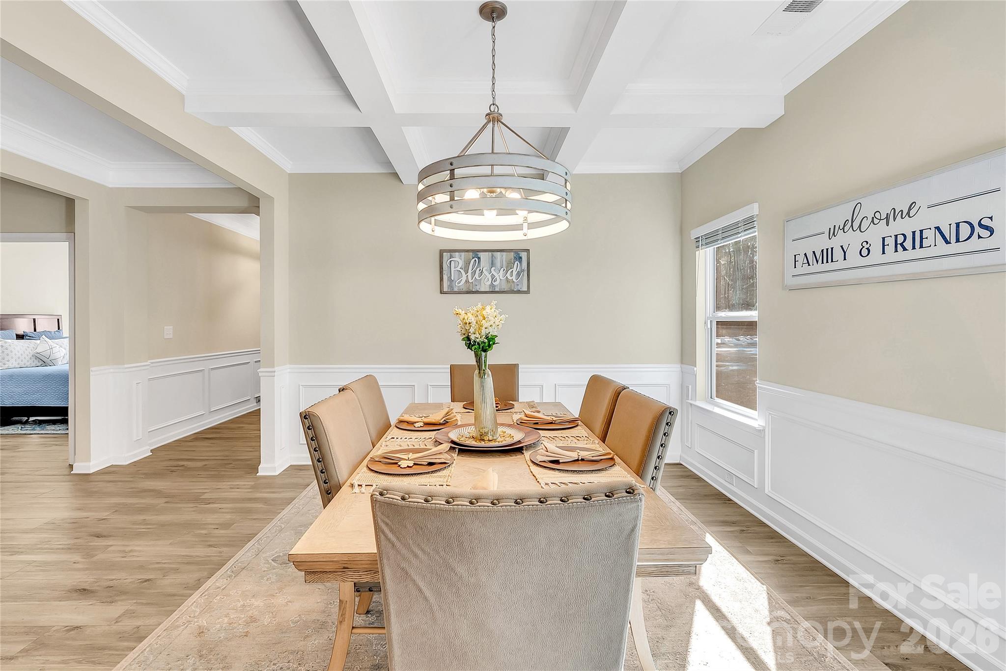 14421 Holbrooks Road Huntersville, NC 28078 - Photo 11 of 29 a dining room with furniture a chandelier and wooden floor