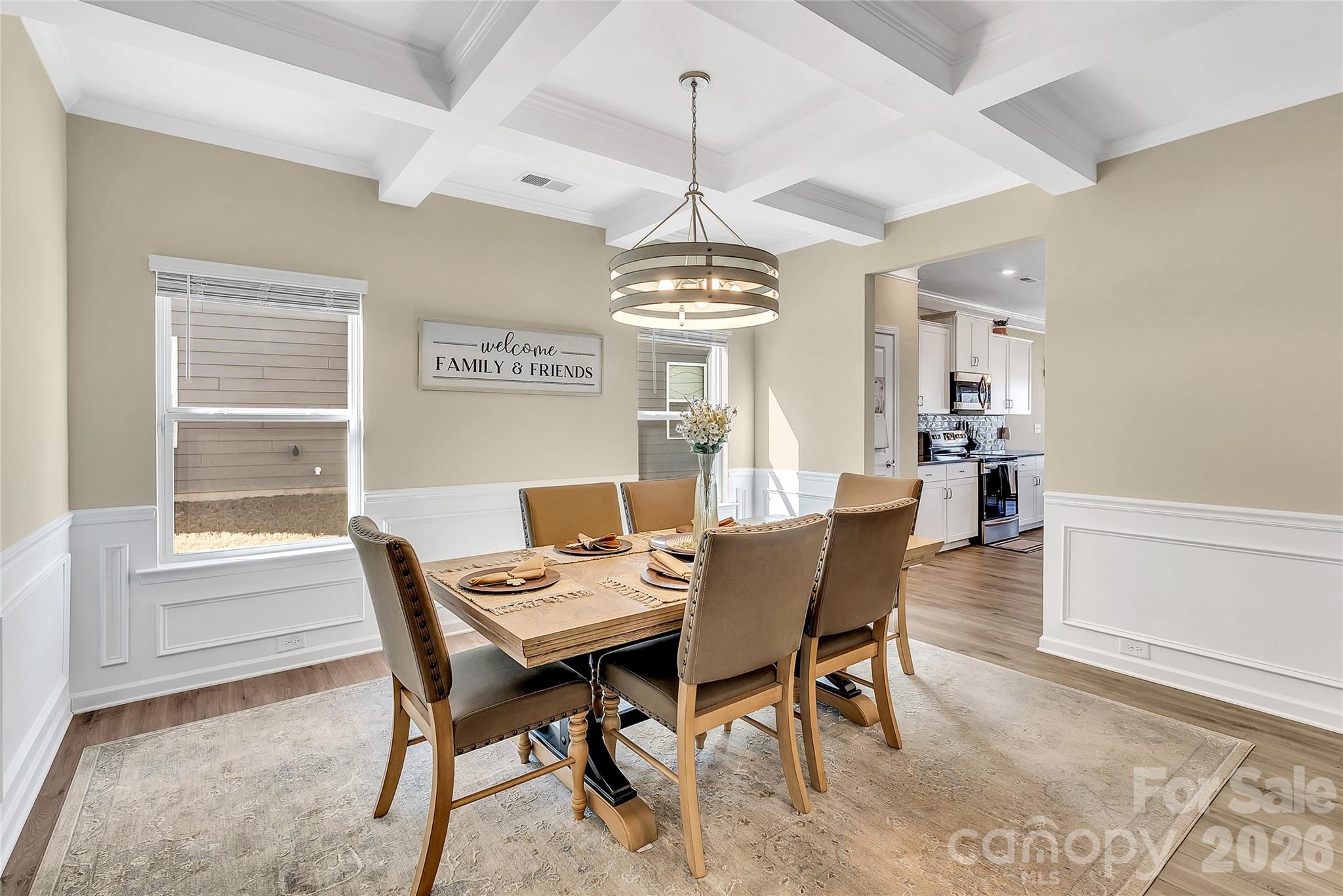 14421 Holbrooks Road Huntersville, NC 28078 - Photo 12 of 29 a dining room with furniture a chandelier and wooden floor